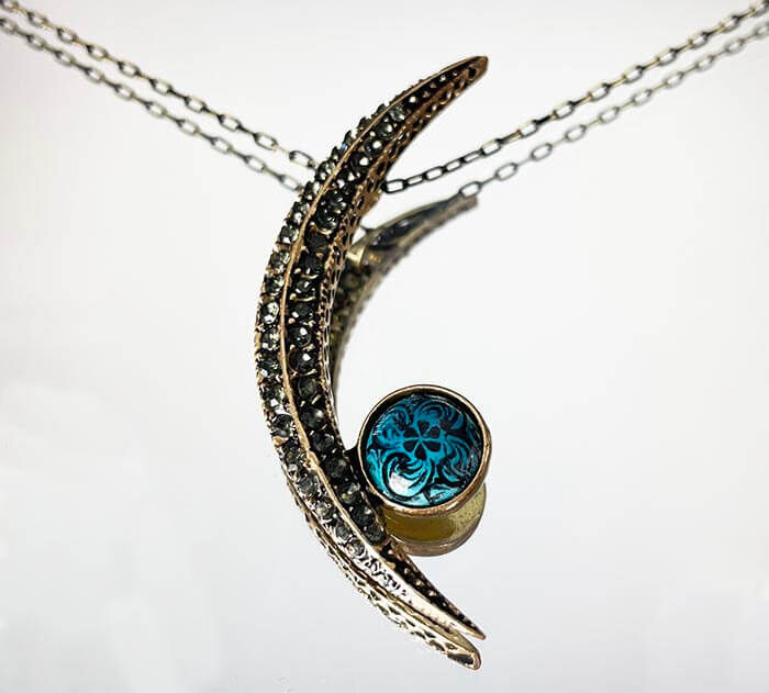Turquoise Ground Golden Horn Motif Half Moon Bronze Pendant - 1
